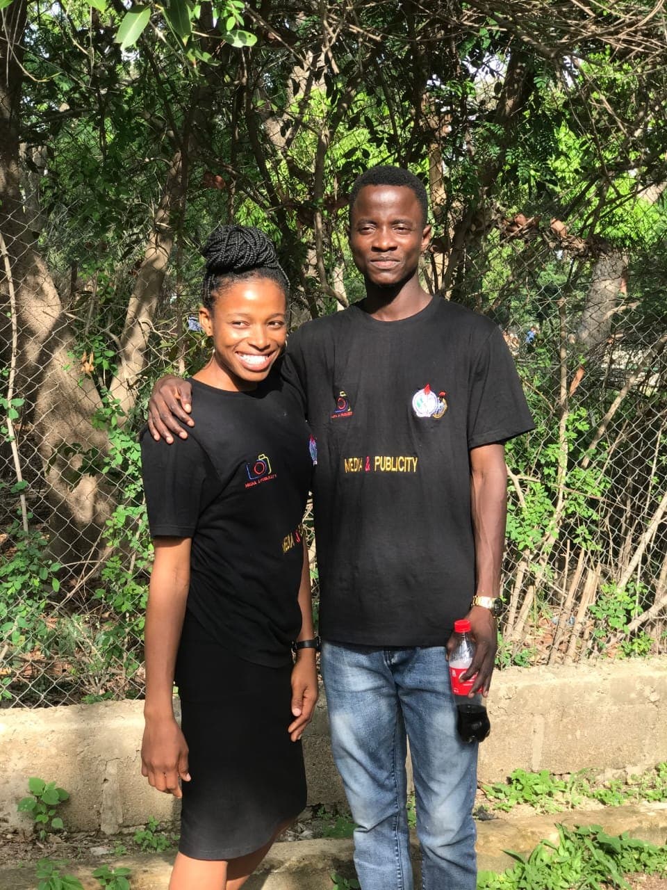 Scholarstica and Joseph in matching Media and Publicity ministry shirts during their early days in Aba